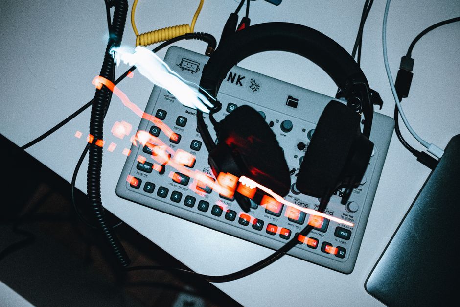 Top view of synthesizer with headphones. Modern electronic music technology on display.